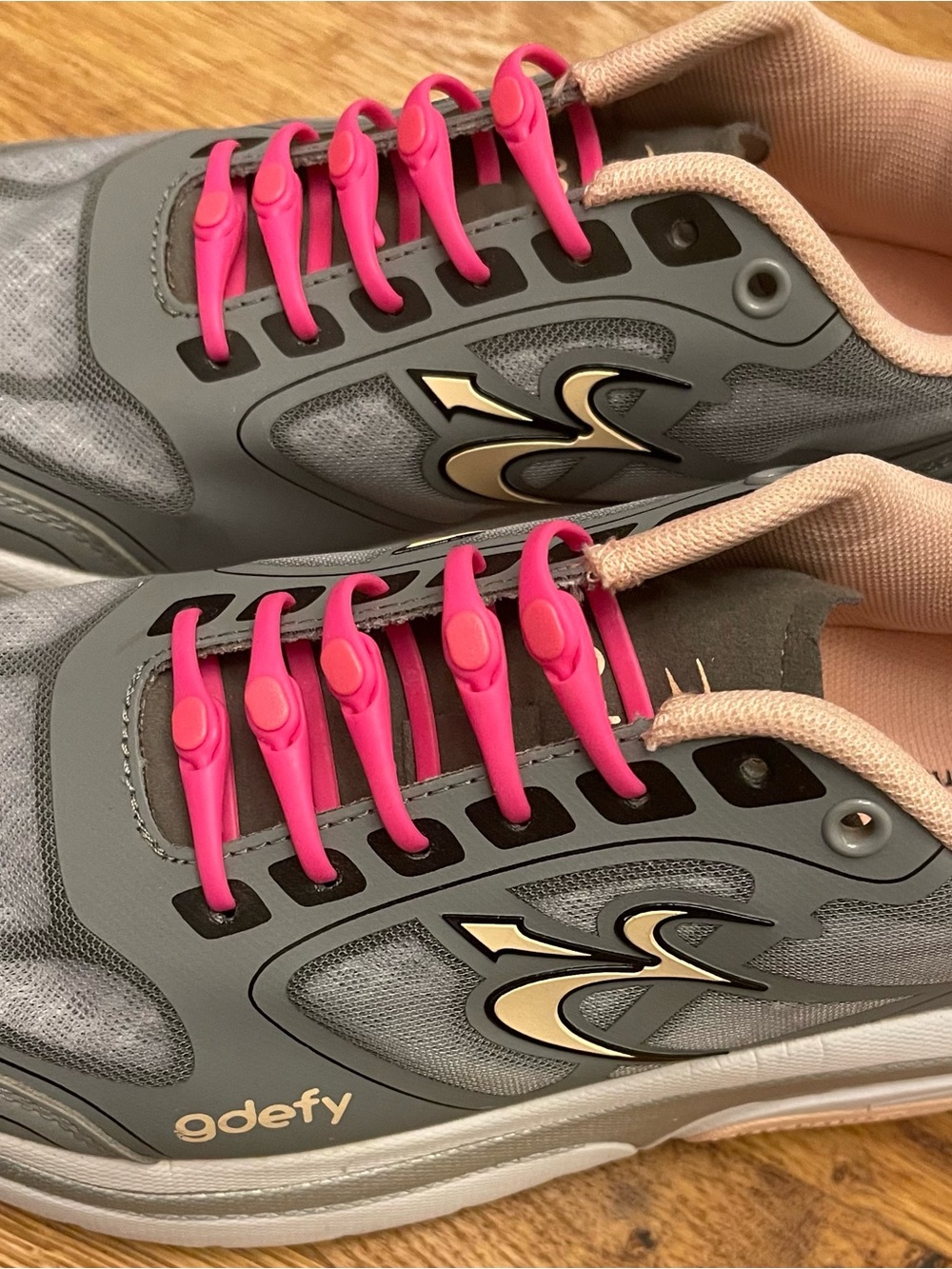 Women’s GDefy Gray Athletic Sneakers with Pink Lace Accents Store Display